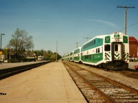 Back in 1993, my sister had picked me up in Waterloo for an overnight visit to her place in Guelph. Being incredibly new to this hobby at that time, I asked her if we could go by the Guelph train station as it seemed the most logical place to see any trains. As it was a Sunday it was quiet, however I was able to see and photograph my first GO Transit train-set laying over by the station. This train operated from here to Toronto daily during the week and offered the first round of GO Transit service into the Royal City on the CN Guelph Subdivision. Even though ridership had increased, this route was eventually terminated not long after in the mid-90’s. 
