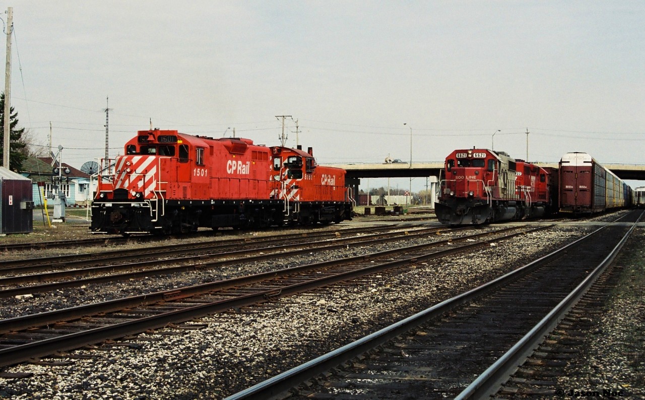 Back in the mid-90’s when CP had an active yard in Galt things could get busy. Here was an example as SOO Line SD40-2 6621 and SD40 6402 are lifting two hot cars from Butler Metals in Cambridge out of track WG-1 before continuing their trip to London over the Galt Subdivision. To the left, the morning Galt Job with 1501 and 8161 has likely completed their day after setting-off their Toyota loads, which can be seen in the passing track to be lifted in the near future.