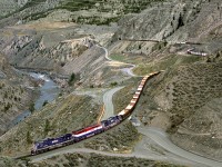 A mixed freight southbound descends into the Fraser Canyon via a 2% plus grade from Kelly Lake to Lillooet 