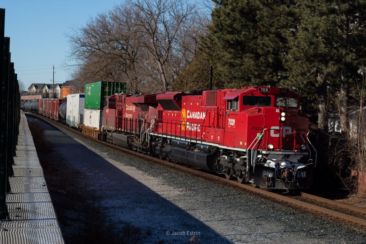 CP 7031 is in the lead of 420 as it heads South through Weston approaching the CN connector.