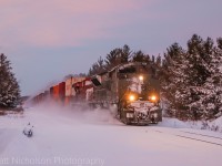 In what is usually a train to travel down the CP MacTier in the early hours of the morning, this time it ran late several hours giving railfans a slight opportunity to catch it with daylight. As the sun quickly faded railfans were aware CP 7020 was in the lead and some were brave to venture trackside for it. Luckily, I live close by so I also made my way out as the snowstorm paused for a while. This would be the first time it has lead on the CP MacTier to my knowledge. 