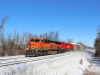 The sun is out, the sky is a nice blue, the weather is cold, and a nice set of power makes the day. BNSF 6558 with CP 7042 race on through Guelph Junction passing a parked T69 on its way for a stop at Wolverton.