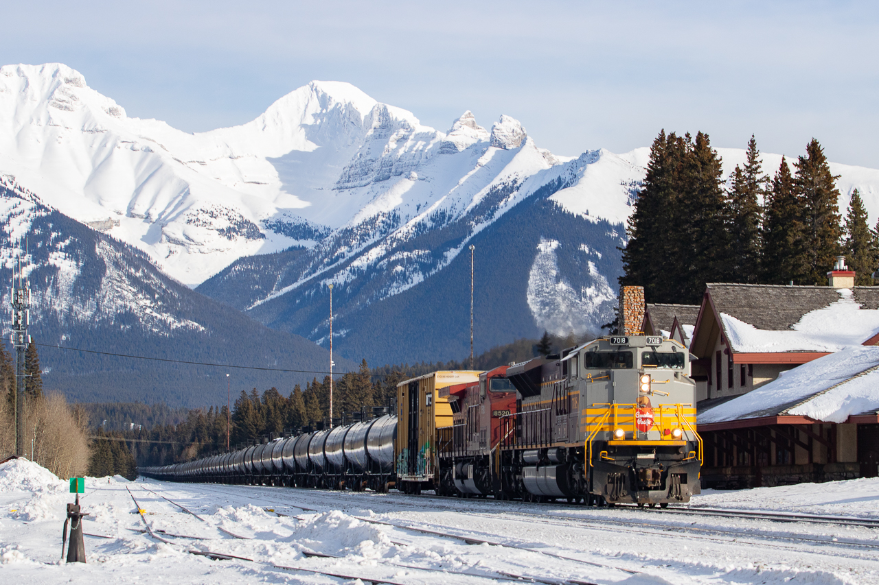 Hey I finally caught one leading! CP 7018 in CP block heritage paint passing by the Banff station with some oil tankers. The previous westbound an hour earlier had 7019, but as second unit.