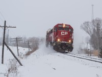T78 kicks up the fresh powered snow as it flies West on the Galt through Innerkip, Ontario on the approach to Pender.