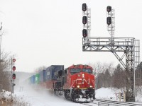 I rarely make it over to the Bala sub. but a PD day for my boys made us try something different. The day for the most part was a wash with next to no trains and bad weather quickly rolling in, but at least I was able to try this angle at Richmond Hill South that would definitely not work on a sunny day. It is nice to see some of these old signal bridges still surviving even if the signals have been replaced. Here CN 101 has just met a southbound and is digging into the grades the snowfall gets heavier. The trains seen passing the GO station with another GE pushing hard on the tail end. 