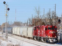 Large snow piles can be a railfans best friend in the winter months. It is nice not having to fight with chain link fences for once, even if it is only for a few months. While GMTX 333 seems to have taken up permanent residence in Streetsville yard it is still nice to follow T14 around when time allows. The oversize signal on the south track at the GO station looks a little out of place here and even has different heads then the one on the north track. This is mainly due to visibility issues from the curve to the east of the station and the height of the station platform overhang. Here T14 heads home to West Toronto after working both Streetsville and Hornby. The scrap gondola is a bit out of place here but I believe it was left several days earlier by an eastbound train after it set off the hot box detector.  