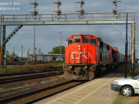 Just  a few months after getting a half decent camera, I'm in Sarnia visiting the in-laws and decided to spend the morning for the rush. CN 148 (I Assume given the timing) is coming out of the tunnel at 0940 with a nice class leader and there's no sun to be had, just as the train came into this frame the sun came out. That's my 1st vehicle at right, "Bessie" as I called it. Things were different even then.