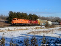 Approaching Ayr, CP 235 with the Hapag-Lloyd "Saint John Express" commemorative unit rolls by the old quarry near Ayr in beautiful winter light. Normally gone by the time I wake up, a defective crossing and taking switches in hand at Guelph Jct East allowed me plenty of time to get ready at home then to head out and find a spot. Thanks to Bill Miller for the location suggestion.