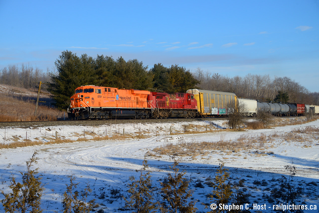 Approaching Ayr, CP 235 with the Hapag-Lloyd "Saint John Express" commemorative unit rolls by the old quarry near Ayr in beautiful winter light. Normally gone by the time I wake up, a defective crossing and taking switches in hand at Guelph Jct East allowed me plenty of time to get ready at home then to head out and find a spot. Thanks to Bill Miller for the location suggestion.