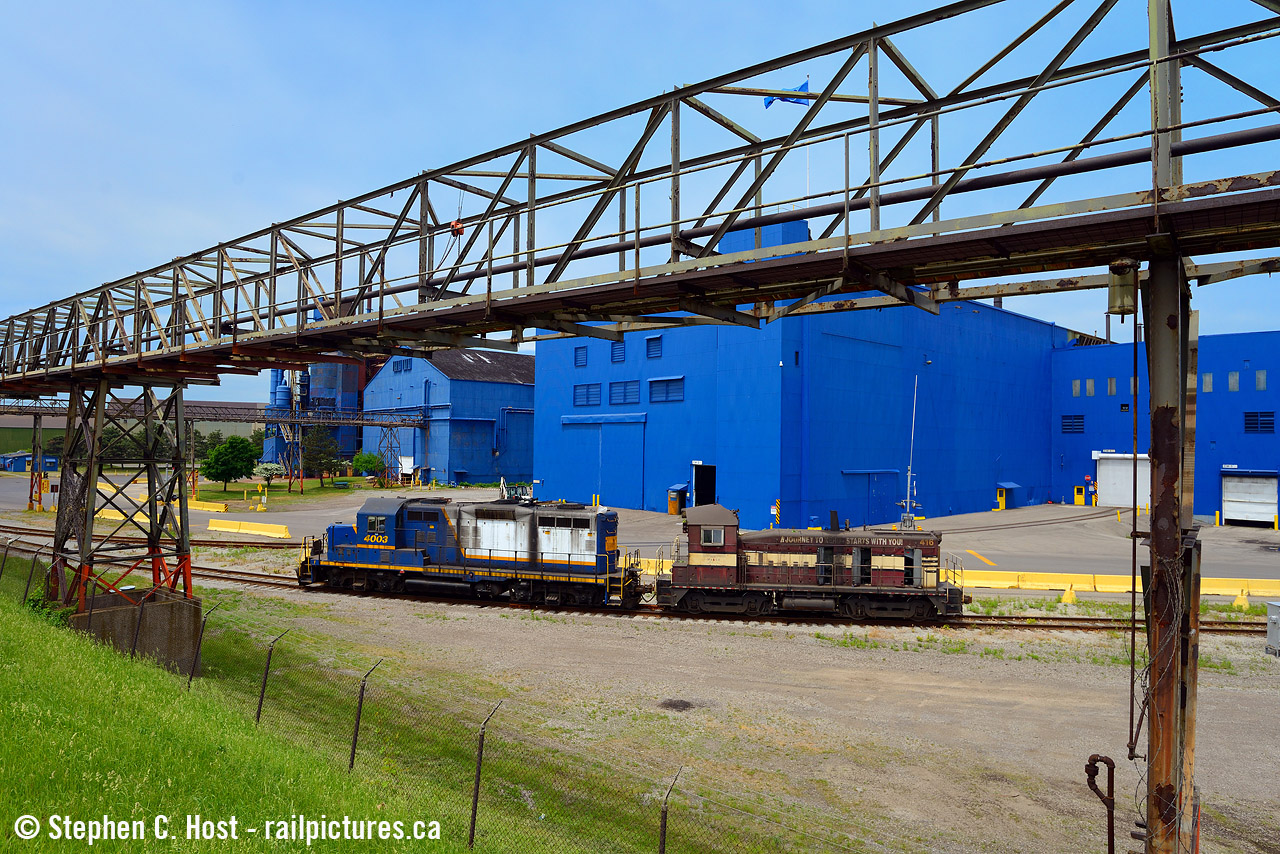 Enemy Territory: A Dofasco locomotive in Stelco territory? Yes, it happened! After some kind of incident crushed the cab of 416, it was sent to nearby Railcare for work. After being lifted from Dofasco Bayfront (The last such move that I am aware of from here to date) the crew had to go into Stelco to lift a gaggle of loaded coil cars, light power. Leading the movement is Dofasco 416 well inside the Unionized Stelco facility. After lifting Stelco, the crew then ran light power into Railcare to deposit the locomotive :)