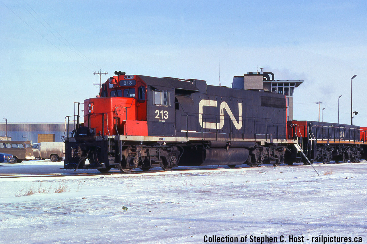 So I was gifted a collection of slides that from all evidence before me seemed to belong to a feller named R.A. Matthews of Biggar Saskachewan. Somehow this collection ended up in Guelph at a second hand store, a buddy (not a fan) bought it for me and gave me it all for my birthday some years ago. He paid around $30 for it all. There's about 1000 slides in the collection, mostly photos taken by the photographer, all in numerical order and all are CN or CN related (including VIA) but he also traded a ton with others in order to fill the collection in. It's a wonderful time capsule of what CN's roster was in the 1970's and 1980's and is mostly complete from a locomotive model perspective. However, I have very little to go on - can anyone help fill in the blanks on who R.A. Matthews is and is he still around? Please comment below or send me a private message as required becasue google comes up blank..
Either way, this is one of the things that intrigued me, the CN slugs that are still with us in the 200 and 500 series seemed to have mothers also in the same number series. Pictured is CN GP38 213 which according to one source is now CN 7513. Photographed at Walker Yard in Edmonton. Photo scan by Jacob Patterson, Editing by me.