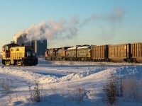 On a frigid Alberta morning, First Generation Diesels meet at Daugh, Alberta, on CN's Coronado Sub.   CN L 55651 17 with a pair of older GE's pull south with RPCX 6311 and RPCX 6304, as On Track Rail Operations Alco S6 1003, looks on.


The FP9Au's are privately owned and were on display at the Alberta Railway Museum in Edmonton, however they are now enroute to Assiniboine, Saskatchewan. They will be interchanged to CP at Scotford in the coming days, for furtherance to Assiniboine. RPCX 6311 was previously VIA 6311, VIA 6529 and CN 6529. RPCX 6304 has a more storied history... Formerly VIA 6304, VIA 6509 and CN 6509 - it was also numbered 1967 and saw service on the Confederation Train in 1966 and 1967.