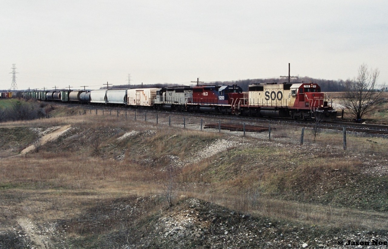 Thanks to some early spring overcast a mid-day CP eastbound with SOO Line 765, HLCX 6200 and HLCX 664 is viewed at Orrs Lake, just west of Galt, Ontario. This train will soon be meeting SOO 6621 which was heading west that same afternoon on the Galt Subdivision.