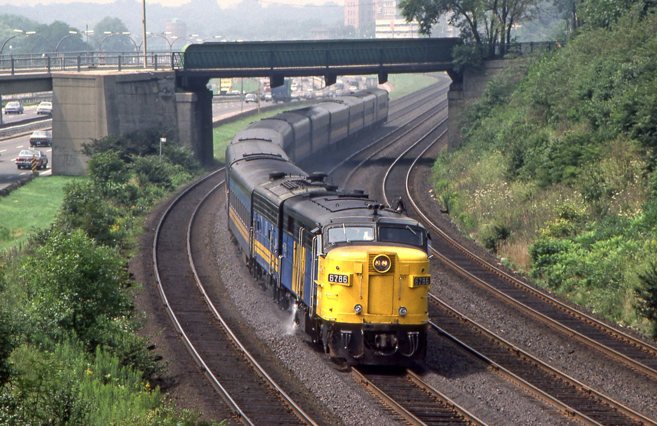 VIA 6786 is eastbound in Toronto in August 1986.
