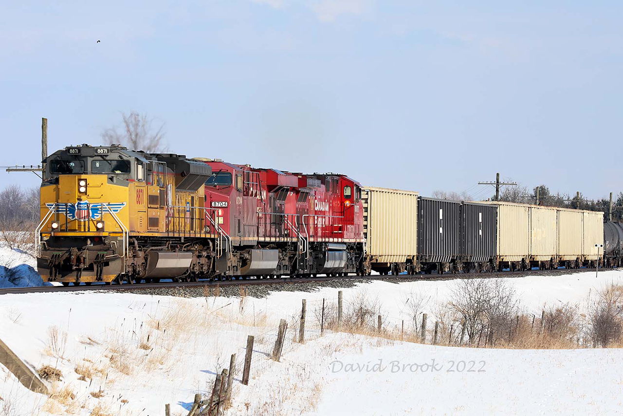 A true embarrassment of riches on the4 Galt Sub. Thanks to a tip from Brandon Muir, I was able to capture the adventure that was CP 244 and 255. UP 8817, 244's train had dropped all its cars at Wolverton and was running light to Toronto when the plan changed. At Guelph Junction, it rescued a very late running 255 which made it to the top of the hill before one of the units ran out of fuel. So on a crystal clear cold winter's day, we have UP 8817, CP 8704 and 8077 heading west for London. For a moment, Ontario became Nebraska.