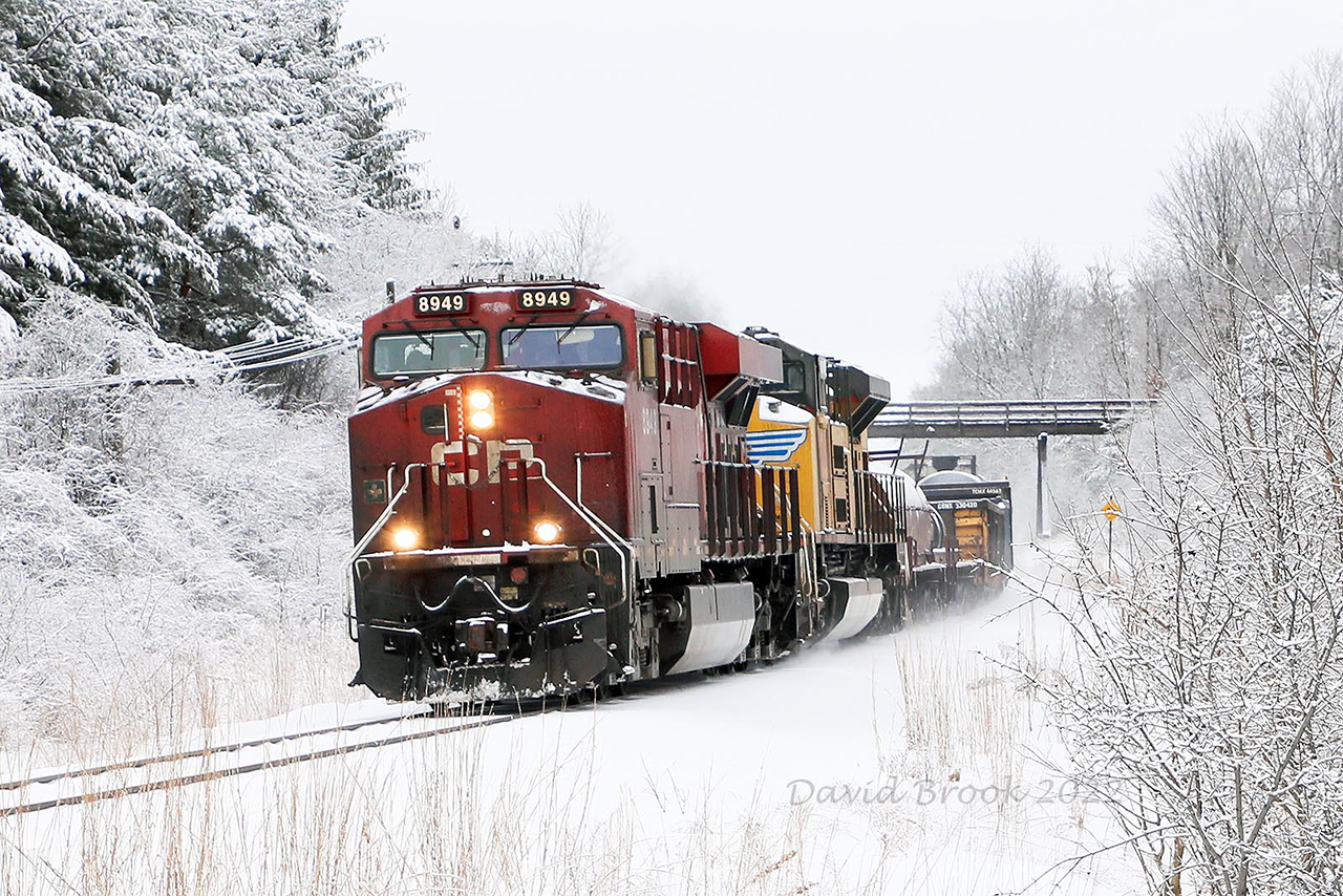 Mother Nature has once again kicked the railroads schedule right in the teeth. Running about 6 hours late on its Toronto Chicago run, 141 isn't setting any speed records it rumbles into Galt with UP 8608 (which has been in Toronto for at least a week, and Mid-DPU 8548. But they sure look nice heading for the challenge of Orr's Lake Hill in a sea of white.