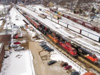 CN X396 rolls through Brantford behind CP 9353 and BNSF 4109.  They are passing a tied down CN 394 on the North track.  Timing worked well as this meet happened during my lunch break.