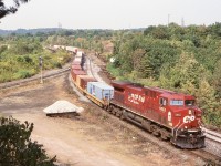 An image this week of a CN train being led over CN’s Dundas subdivision brought back  memories of a train I caught back in 2004, when a derailment along CP’s Galt sub. lead to a few detour trains over the CN. Here train 158 is about to head into the Oakville subdivision and back to home rails at Canpa. 
