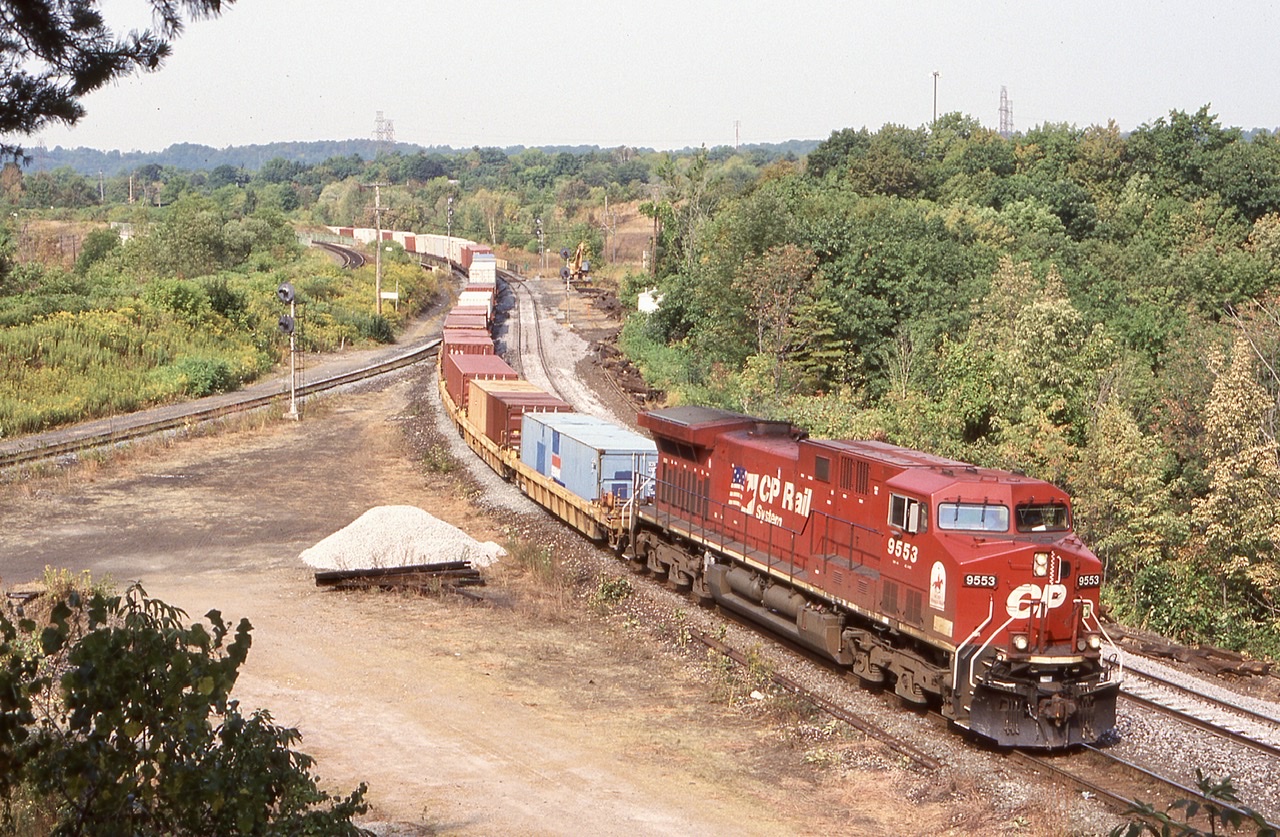 An image this week of a CN train being led over CN’s Dundas subdivision brought back  memories of a train I caught back in 2004, when a derailment along CP’s Galt sub. lead to a few detour trains over the CN. Here train 158 is about to head into the Oakville subdivision and back to home rails at Canpa.