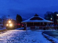 With very little light left in the day, train 594 heads by the tourist bureau in Hampton, New Brunswick. The bureau is somewhat lit up for Christmas, which was nice to see. 