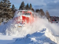 The morning after a snowfall with high winds dumped 30-40cm, 594 heads through some snow banks and drifts. I lucked out as this train never made it out of Moncton last night and had to be recrewed this morning. Seen here around mile 81 at Torryburn, approaching Saint John, NB.