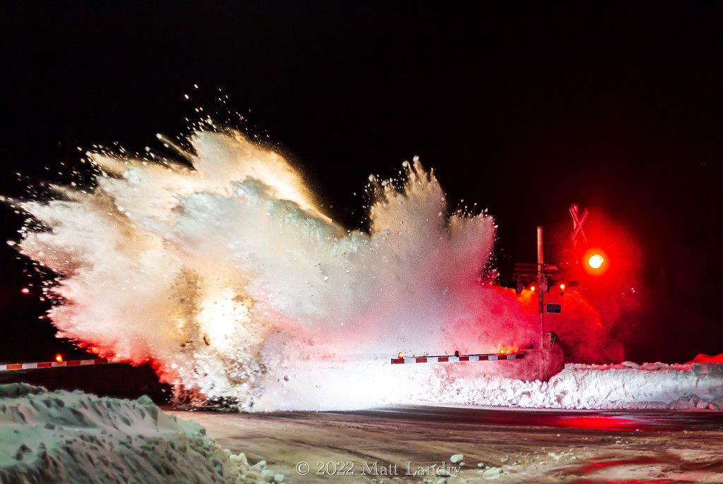 Norfolk Southern 4110 and CN 3938, an ex CREX pony power train 594 through Hampton, New Brunswick. The day before, the area received between 30-50cm of snow. Unfortunately the weather set back many of the trains in and out of Moncton, which caused this train to run overnight. I normally don't do night shots, mainly because I suck at it, but post storm snow drifts and a great lashup on a CN freight, I couldn't pass the opportunity up for a "poof" shot.