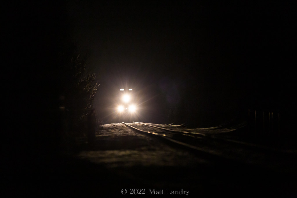 About 30 minutes before sunrise, CN 121 lights up the track getting up to speed approaching Berry Mills, New Brunswick.