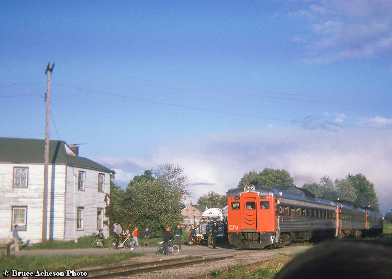Late in the day on a UCRS trip, a trio of RDCs (CN 6116, CN 6003, CN 6120) are seen moving away from the photographer during a photo run by on the Drumbo sub at Bright.  The trip ran from Toronto - London via the Oakville and Dundas subdivisions to reach the GMD plant for a tour.  Following the tour, the trip departed London for Hyde Park, taking the Exeter Sub north to Clinton and on to Goderich.  Returning to Stratford, via the Drumbo sub to Paris, and back to Toronto.