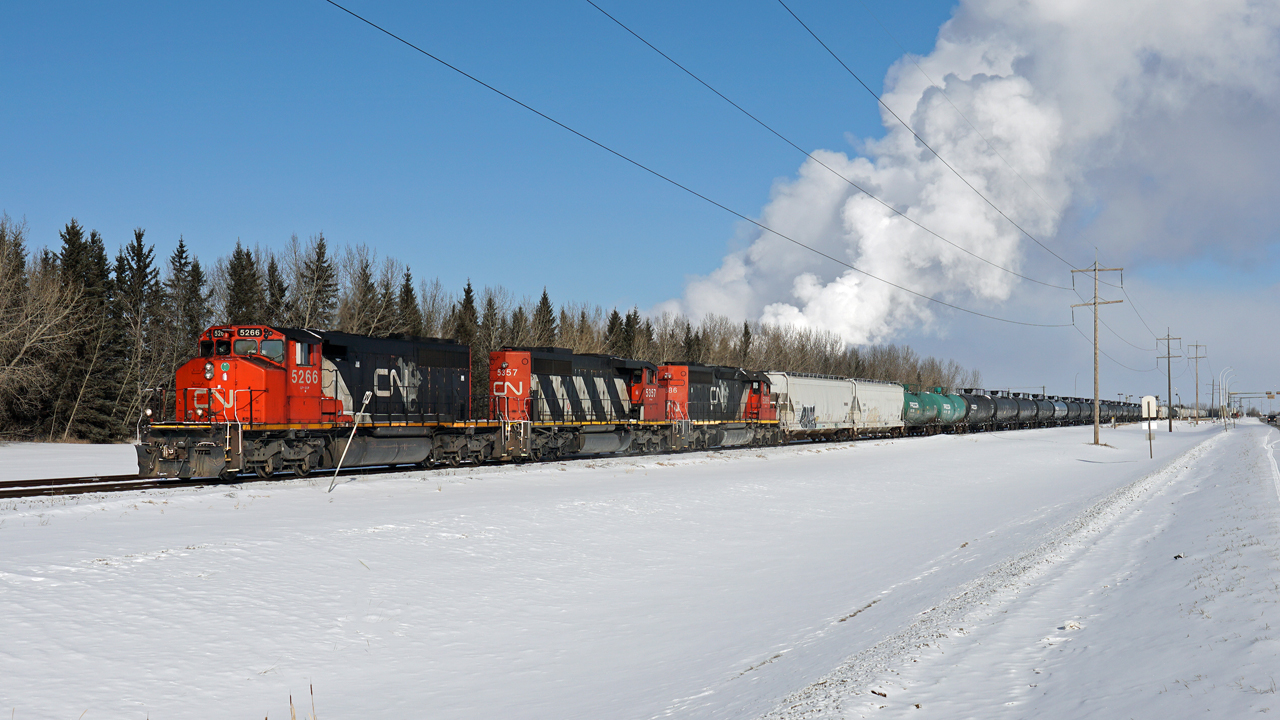 On a cold (-20C) but sunny Family Day a trio of CN's old faithfulls work the Fort Saskatchewan Industrial Lead.
CN 5266, 5357 and 5386