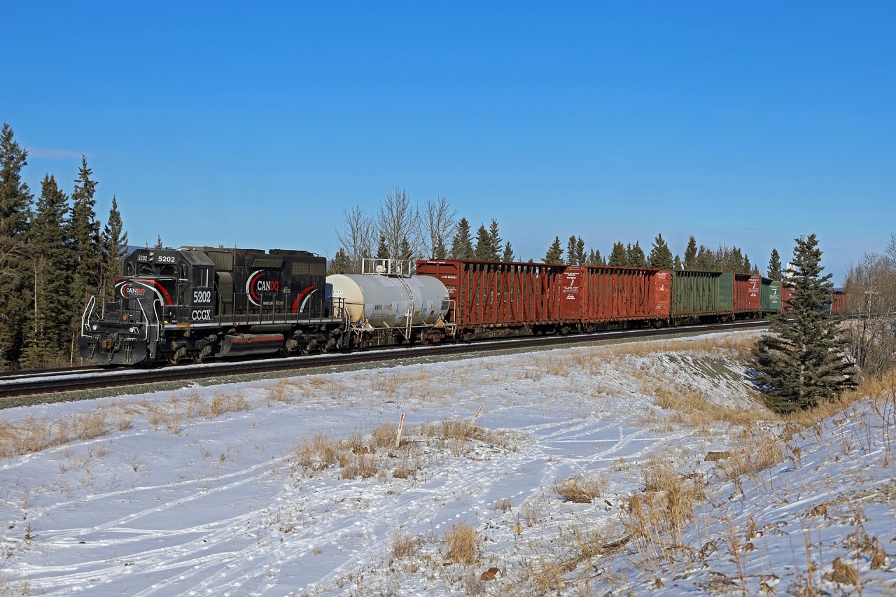 Cando SD38AC (CCGX) 5202 has just lifted cars from the small CN yard at Hinton and is heading back towards the West Fraser mill.