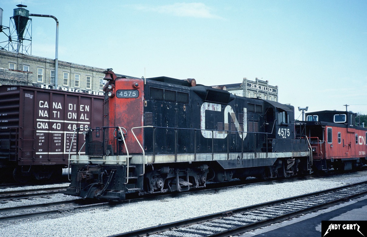 CN GP9 4575 and caboose 79614 are at Kitchener, Ontario in August 1981. GP9 4575 would eventually be rebuilt into GP9RM 7013 and was officially retired in 2000.