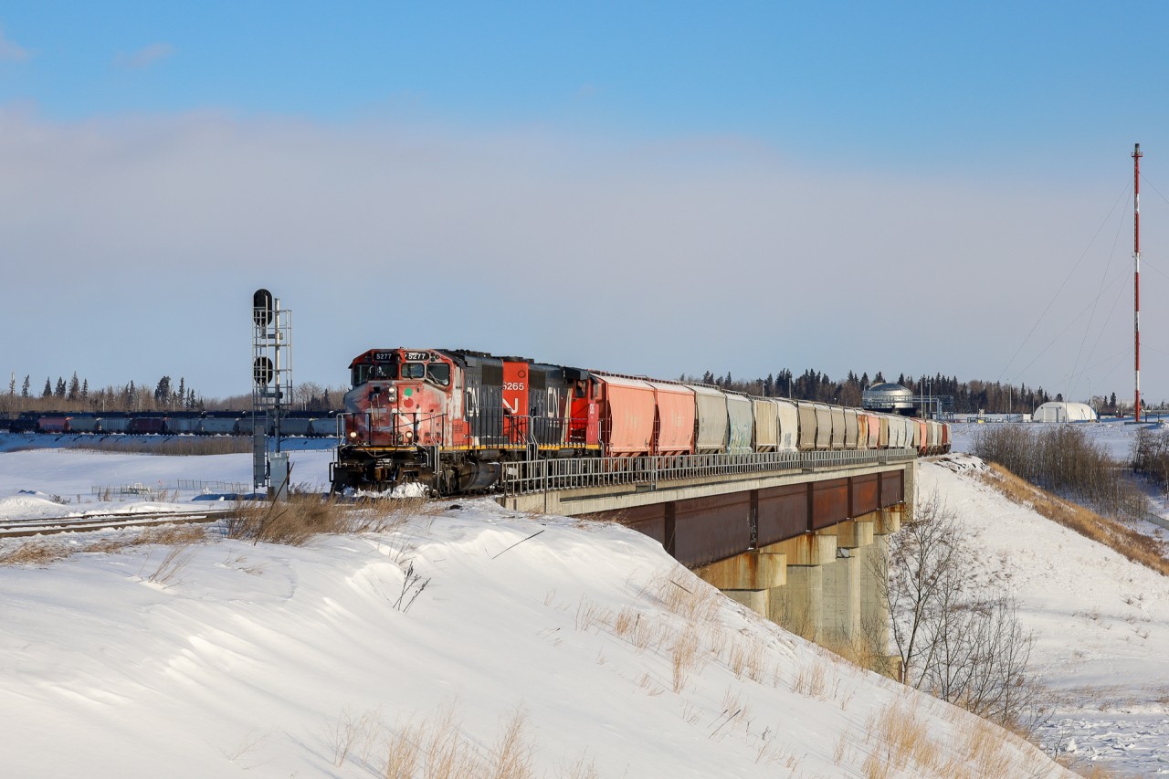 Looking a little worse for wear, CN 5277 and CN 5265 cross the mighty North Saskatchewan River at Beamer Junction.  The train is about to diverge off the Vegreville Sub and onto the Beamer Industrial Spur, the 5277 has a protect against CN 5321, which is working at Pembina Redwater.