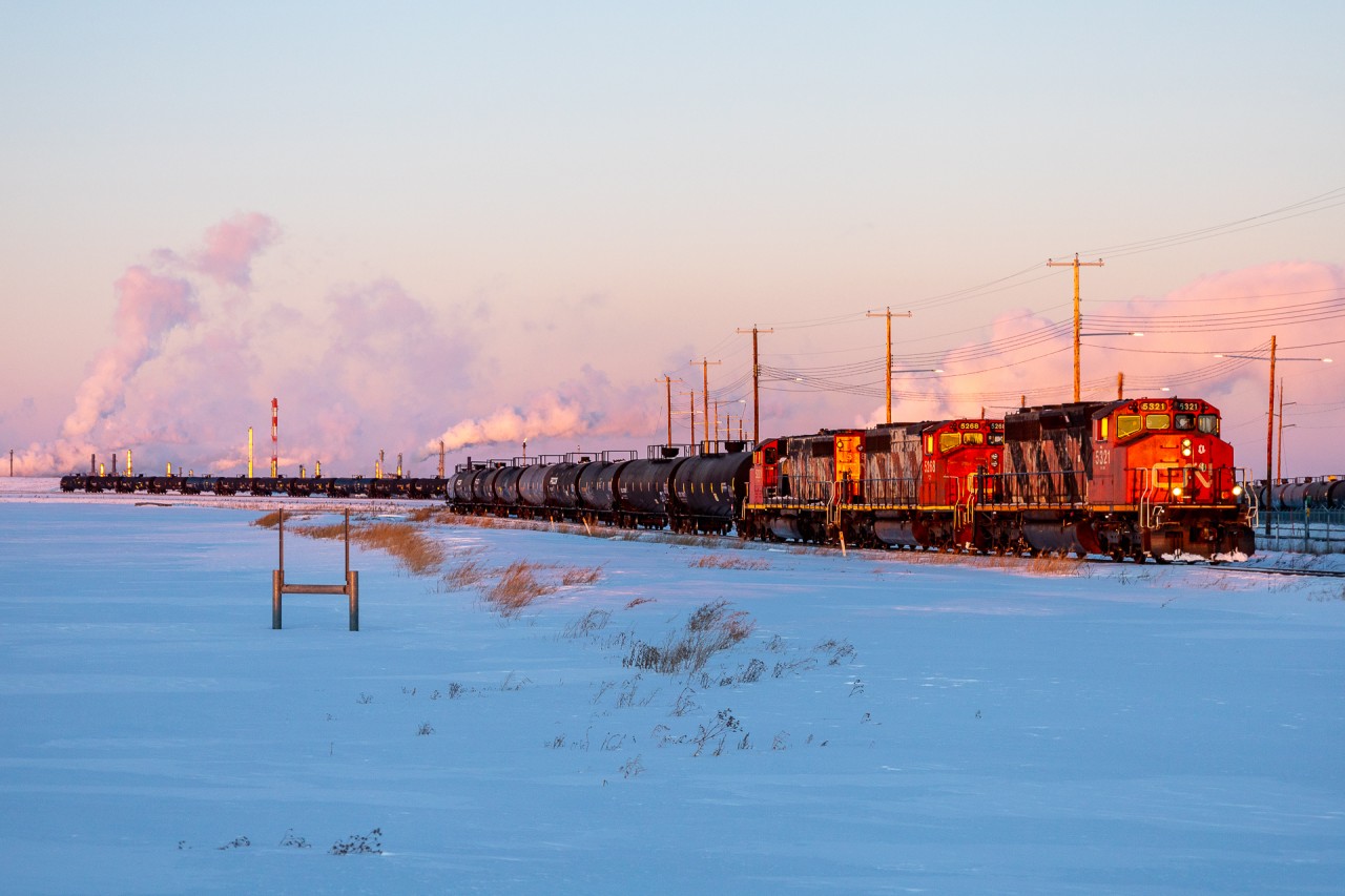 Sunset on January 18th was 1650 and with minutes to spare, at 1642 L 51452 18 finally pulls out of the Pembina Redwater storage yard with three matched Zebra Stripe SD40-2Ws; CN 5321, CN 5268 and CN 5281.