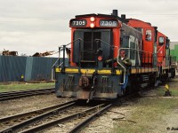 I don’t exactly know where this photo was taken as I believe it was a bail out of the car and get your shots situation. According to the negatives it might be CN 7305 and CN 7031 reversing into the then Stelwire Parkdale Works facility in Hamilton’s industrial core, which is now a current ArcelorMittal facility up on Strathearne Ave north of Strathearne Yard.  Corrections and information are appreciated. 