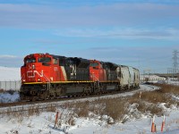 S 77181 05 rolls into Edmonton with 187 frac sand cars, with half the train bound for Leslieville, Alberta on the Brazeau Sub (near Red Deer) and the other half bound for Grande Prairie.  Todays consist was CN 8813, CN 8889, mid train remote KCS 5024 and another mid train remote CN 8852.  If you look closely, you can see the KCS unit between the power poles
