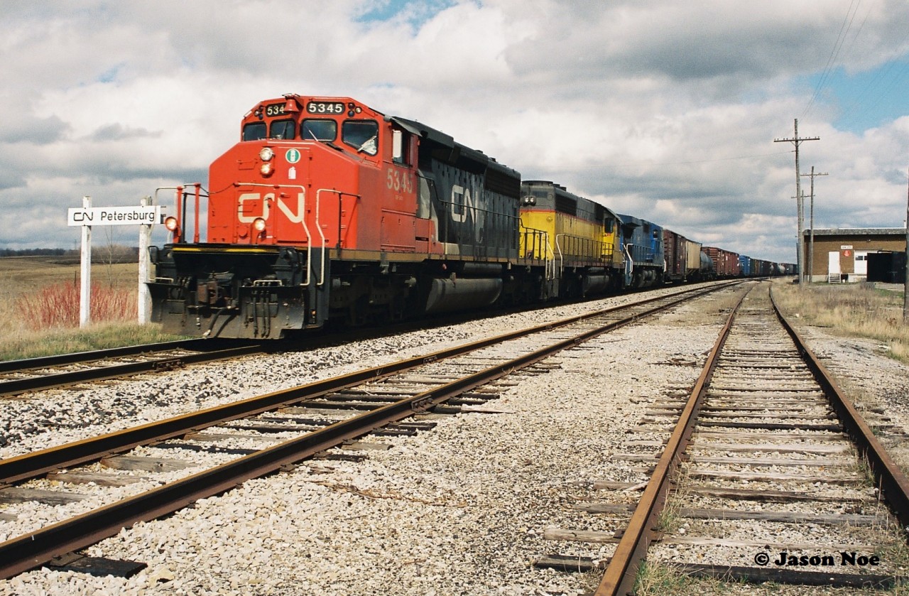 By 1995, CN detours on the Guelph Subdivision were infrequent but they did occur. For whatever reason, CN 383 took the long way to London over the Guelph Subdivision during a late April day.  The westbound is pictured at Petersburg with CN 5345, CN 6106 and LMSX 718. CN SD40-2 6106, nee-UP 4106 would eventually become CN 5373 later in 1995 after being remanufactured by AMF in Montreal, Quebec.