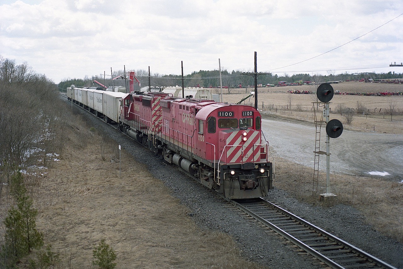 The Triple Crown service on CP was a common sight in the mid 1990s. Pictured here, eastbound at Puslinch, the train is led by the first of the "Control Cabs" (or leader cabs) converted from C-424 locomotives. In this case, the former CP 4236. The unit was de-engined. It ran with #6043, and the purpose saved the problem of having to wye the power upon the return trip, in the same manner as GO features a cab unit on one end.  I am sure the crews had a rather strong dislike of these beasts. The 1100 was retired in 2004 and is now at Expo-rail.