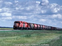 A pair of clean CP Rail GP38-2s head west on the Glenboro Sub with grain hoppers and a few boxcars. We chased this train as far west as Elm Creek to a large Cargill facility which is as far as they went on this trip. It wasn't GP9s and there weren't many traditional wooden grain elevators on the line but it was still a neat way to spend an afternoon. 