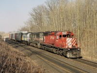 The leasing frenzy of the mid 1990s.  Here is an almost typical westbound approaching Campbellville, with the odd assortment of CP 5836, HATX 501 and VIA 6452.  It seemed anything that rolled was good enough. And the very late afternoon sun was a delight.