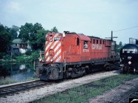 CP RS-18 8784 is rolling through the yard in downtown Guelph, Ontario along the Speed River in the summer of 1982. This unit eventually was rebuilt to CP RS-18u 1852 in March 1989. 