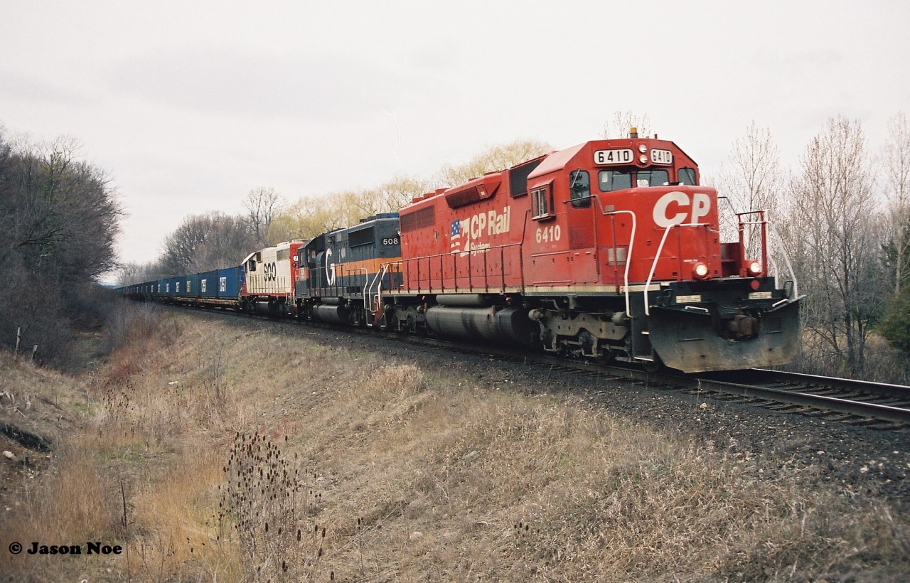 Built as Illinois Central Railroad SD40A 6022 in 1970, CP 6410 is heading westbound back to its former home in the USA as it approaches the Orrs Lake mileboard on the Galt Subdivision. Trailing 6410 are GP40-2 HATX 508 and SOO Line SD40-2 768. HATX 508 would later be acquired by Canadian Pacific and become CP 4654 in 1999.