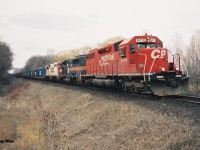 Built as Illinois Central Railroad SD40A 6022 in 1970, CP 6410 is heading westbound back to its former home in the USA as it approaches the Orrs Lake mileboard on the Galt Subdivision. Trailing 6410 are GP40-2 HATX 508 and SOO Line SD40-2 768. HATX 508 would later be acquired by Canadian Pacific and become CP 4654 in 1999. 