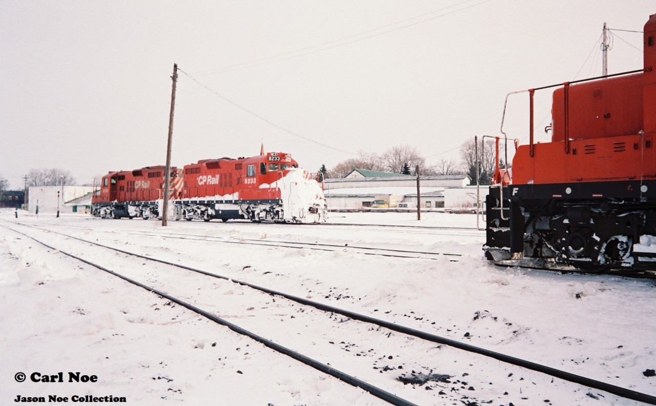 With evidence of a previous battle won on the CP branchlines from Woodstock, GP9u’s 8233 and 8234 depart the yard on the St. Thomas Subdivision light power during an early February morning as CP GP9u 8222 looks on.