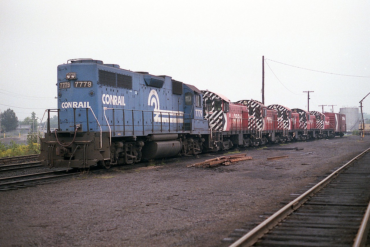 While checking things out in Sudbury on a rather dreary morning; I happened to spot a Conrail unit.  So in I go. Carefully avoiding any personnel who might not want me snooping around; I pretty much stayed in my car and logged the numbers of all units present: CR 7779, CP 7099, 6545, 6588, 6594 and 7090. Nice collection of CP MLWs that I strongly suspect were on their last legs, awaiting retirement or sale.
Facility is near the corner of Lorne and Douglas in the city.