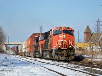 CN ET44AC #3051 leads 421 down and under, then back up again past the Merritt Street bridge in Merritton, which had a small trench dug for stacks to fit under the bridge after a serious miscalculation by RTC in the 90s caused CN 154 hit the bridge with double stacks. 

Nowadays CN 421 (especially this example!), 422, and even extras can be seen with long strings of double-stack containers on any of the 2 main tracks of the Grimsby Subdivision thanks to the addition.