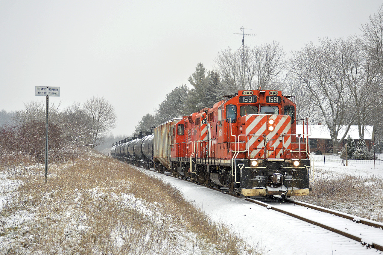 OSR GP9u's #1591 and #8235 lead the St. Thomas Job southbound towards the namesake city and through Mossley, Ontario in a beautiful December snowfall back in 2021.