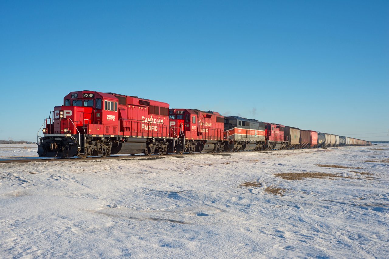 Moose Jaw-Sutherland train N13-11 has a nice variety of power up front as it departs the north end of Regina. The 4th unit, CP 5008 would be set off in Craven for the next loaded southbound to lift.