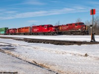 They say a picture speaks a thousand words, and this one certainly has a story behind it.

Here we see CP 9-118 and F55 beside each other at the east end of the yard in Smith’s Falls, Ontario. A trip was made out this way following word that a CWR would be running westbound with the SD40 pictured here at the helm, and a pair of KCS units that were dropped the previous night by 143. Upon arrival at the falls, we were surprised to see that the F55 crew had hooked their GP20ECO up to the aforementioned SD40 and were doing their day’s work with it. We knew F55 is the ID for the Omya (Glen Tay) turn, so we stuck around waiting to shoot the classic multimark GMD leading west on the job. Unfortunately, the waiting did not pay off as after they had built their train, they dropped the 40 and ran to the Omya plant long-hood-forward with their ECO unit…. Effectively, it was a day and upwards of $90 on gas money wasted.

As for the frame here, this was when F55 was in the process of spotting GP38-2 3051 on a cut of stacks for an eastbound to pick up later and bring towards Montreal. Meanwhile an extra 118 is backing up to drop off 2 cars. Something we took note of while being here is how CP seems to be using Smith’s Falls as a mini-classification yard, with 3 separate eastbounds having both pickups and setoffs at the yard with traffic that has nothing to do with surrounding industries, such as large cuts of intermodal.