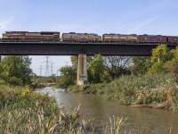 Delayed by a derailment at Parry Sound and meets with subsequent freights, CP 40B rolls south through Vaughan crossing over the Humber River.  Between the set of piers on the right, the Toronto Suburban Railway's Woodbridge Line ran along the banks of the Humber from 1914 through 1926.  The old right of way can be seen in <a href=http://jpeg2000.eloquent-systems.com/toronto.html?image=ser12/s0012_fl1956_it0V11.jp2>this 1956 aerial image.</a>