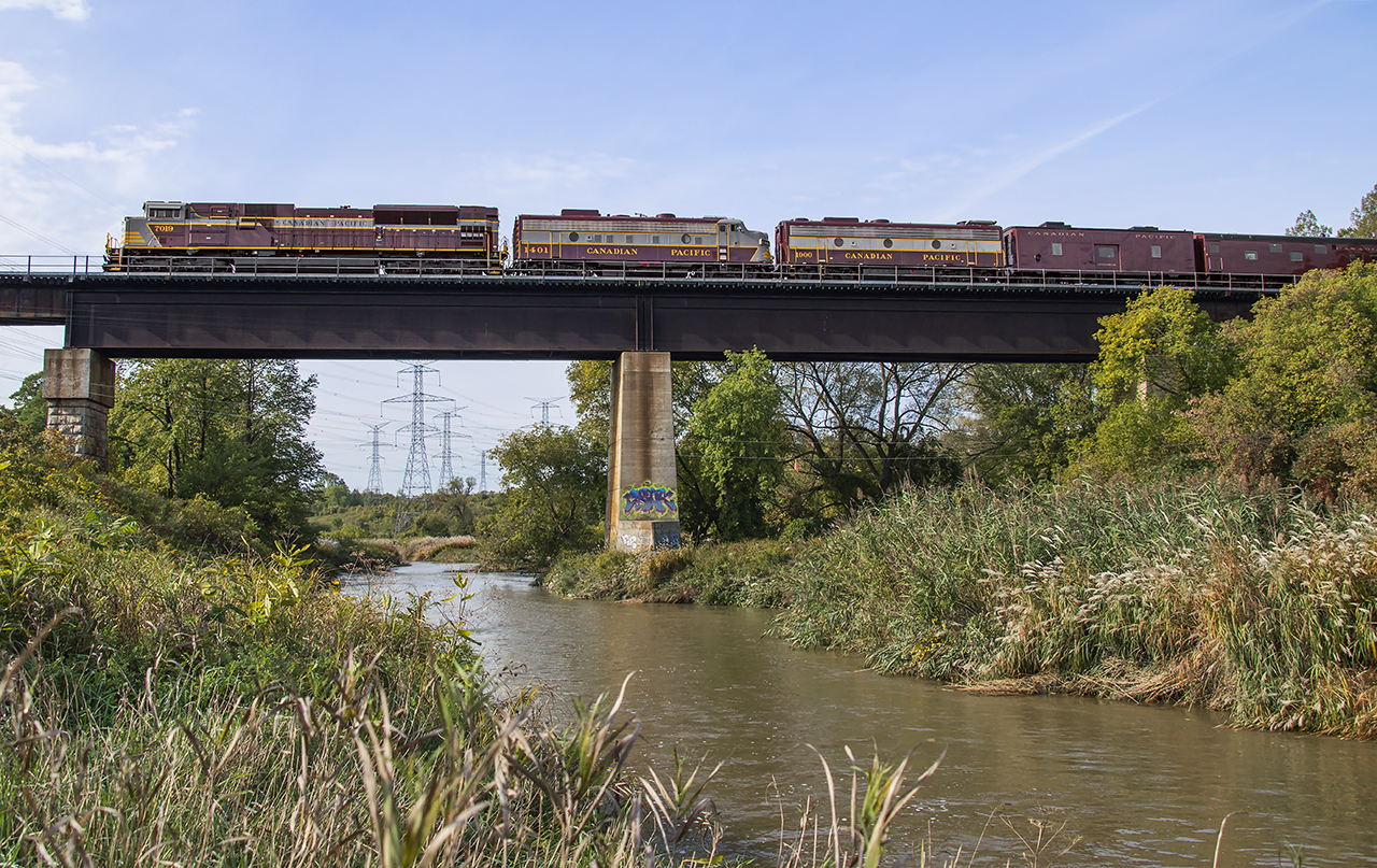 Delayed by a derailment at Parry Sound and meets with subsequent freights, CP 40B rolls south through Vaughan crossing over the Humber River.  Between the set of piers on the right, the Toronto Suburban Railway's Woodbridge Line ran along the banks of the Humber from 1914 through 1926.  The old right of way can be seen in this 1956 aerial image.